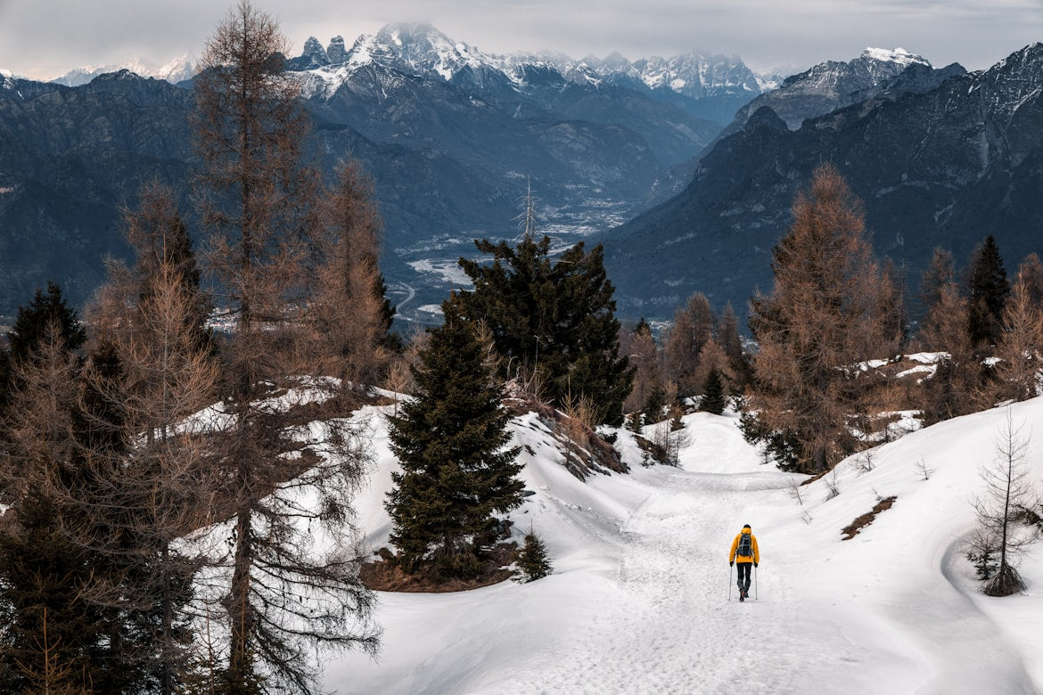 Group of hikers walking along a rocky mountain trail
